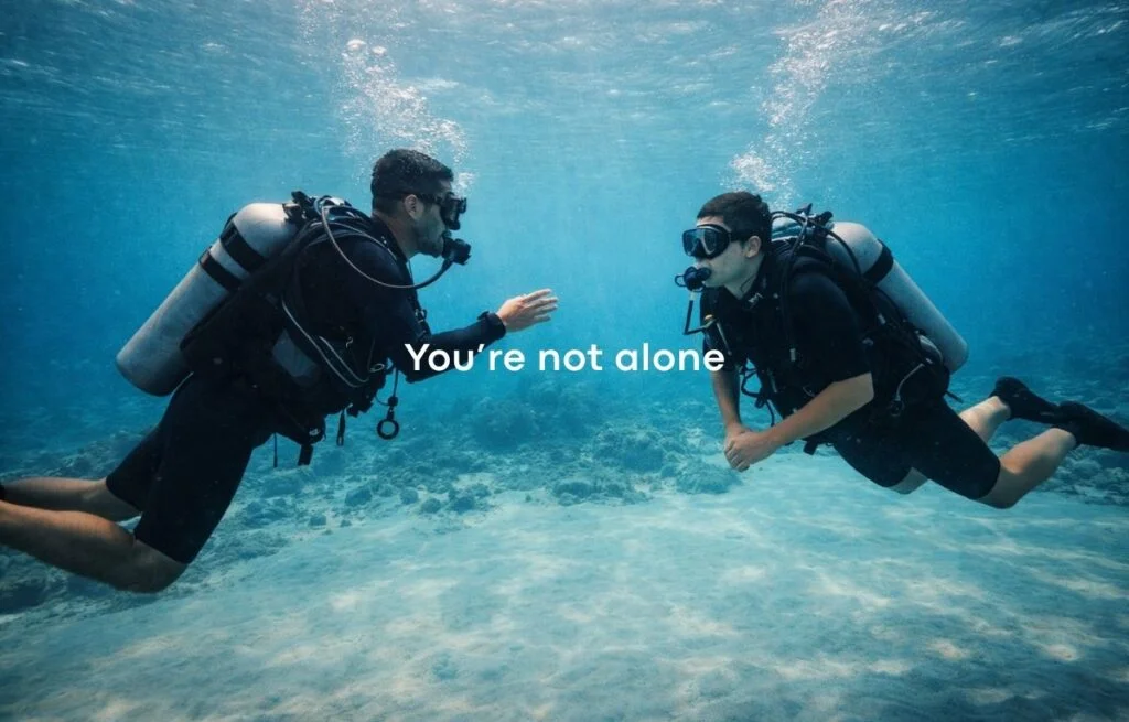 Instructor guiding a beginner during a calm scuba dive in Dubai, showing why Dubai is one of the best places for first-time scuba diving.