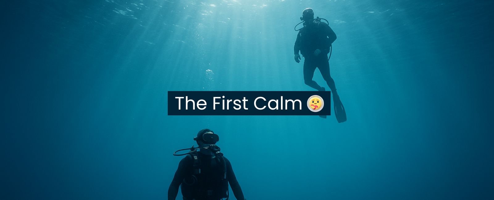 Cinematic underwater scene of a scuba diver floating calmly in open blue water with an instructor nearby, representing how safe and guided scuba diving feels for beginners in Fujairah.